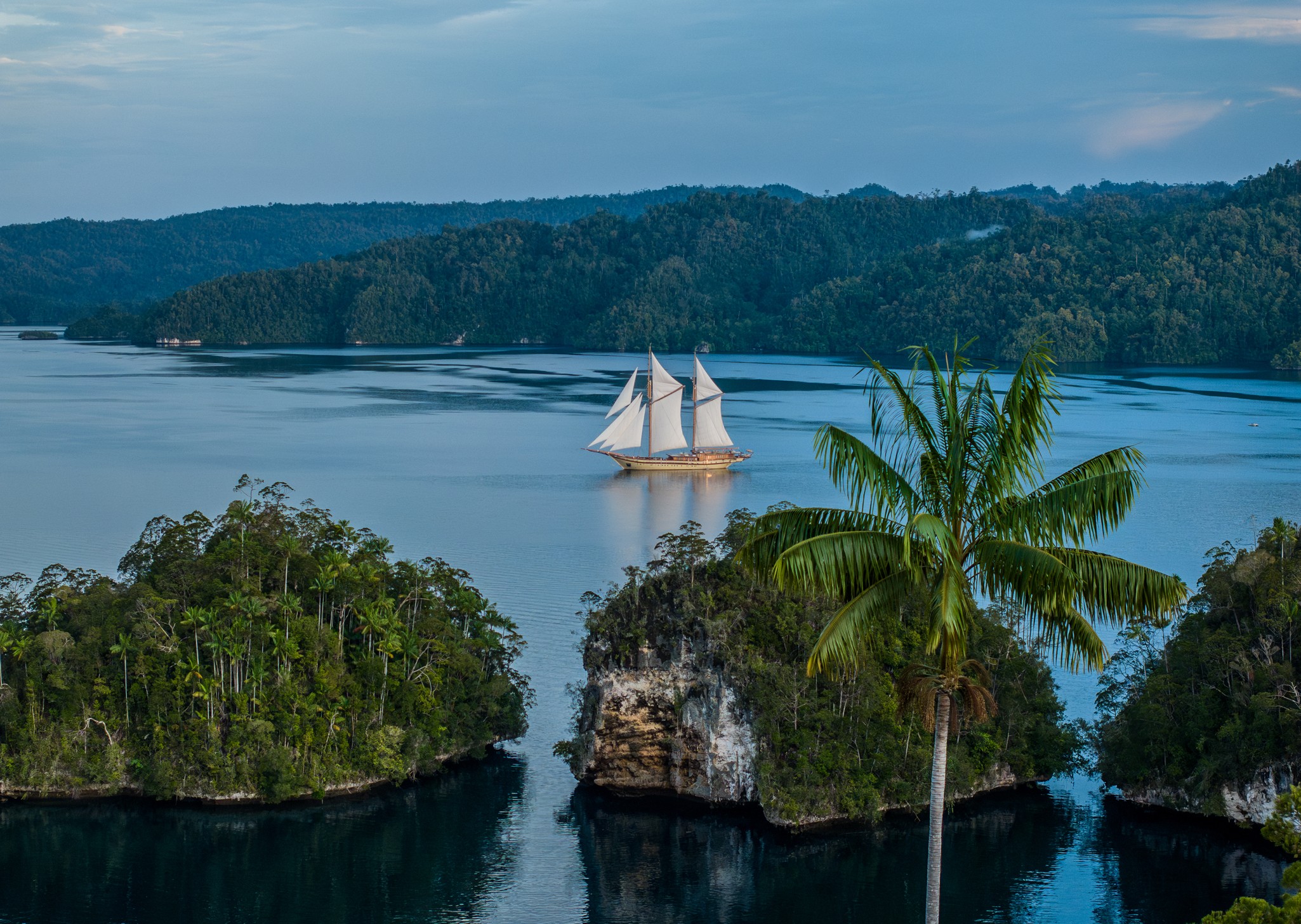 Lamima sailing through a Raja Ampat lagoon